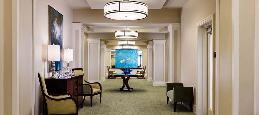 Bright interior hallway with comfortable seating and decor