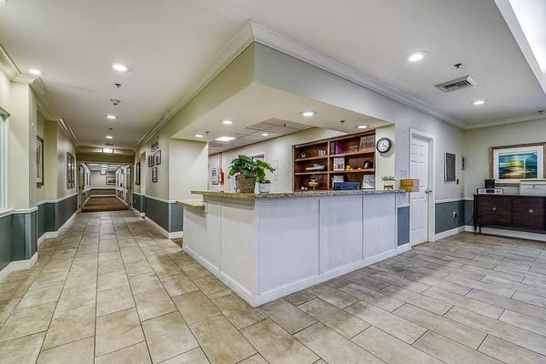 Bright lobby area with reception desk and hallway