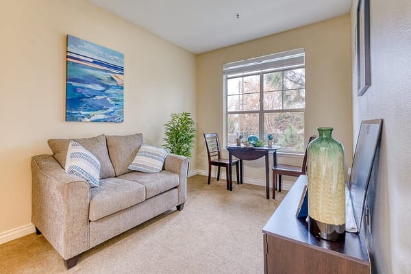 Cozy sitting area with a couch and artwork