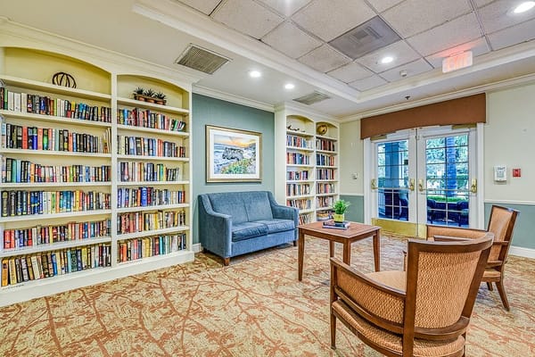 Interior common area with bookshelves and seating