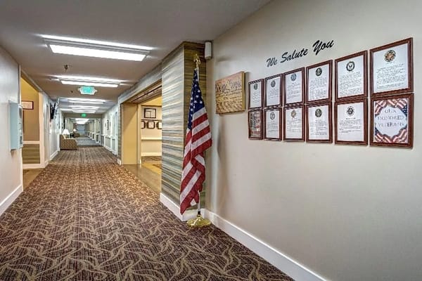 Hallway with an American flag and framed citations