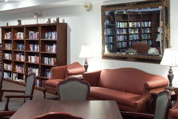 Inviting library lounge with bookshelves and comfortable seating
