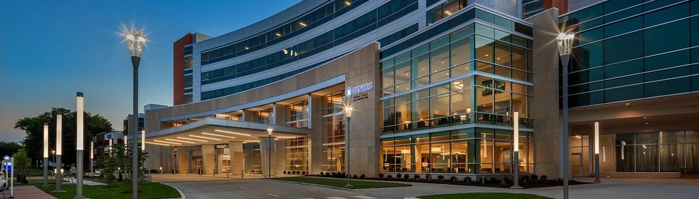 Exterior view of a modern assisted living facility at dusk