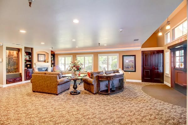 Bright common area with seating and floral decorations