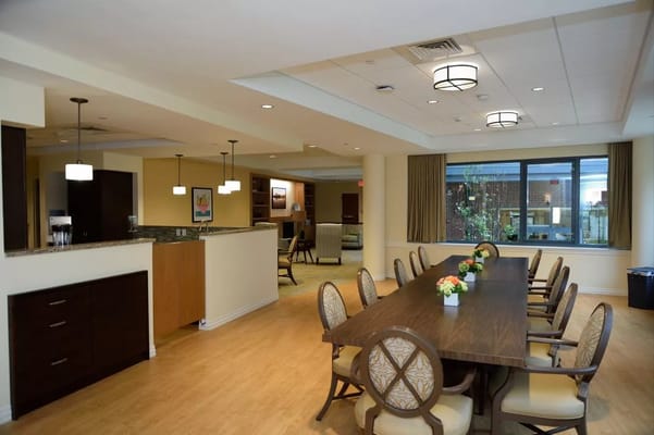 Dining area with large table and floral centerpieces