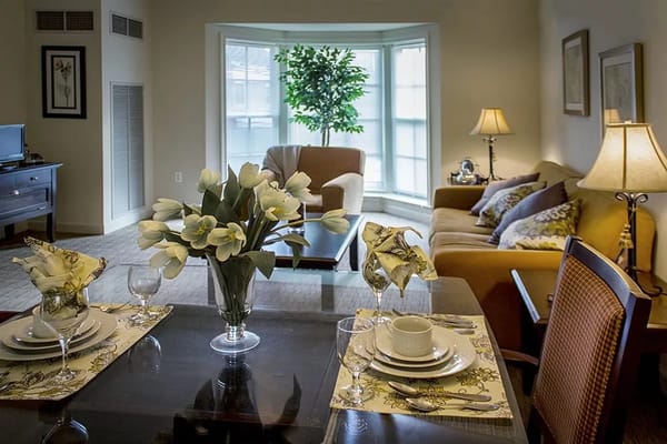 Cozy living area with a dining table and floral arrangement