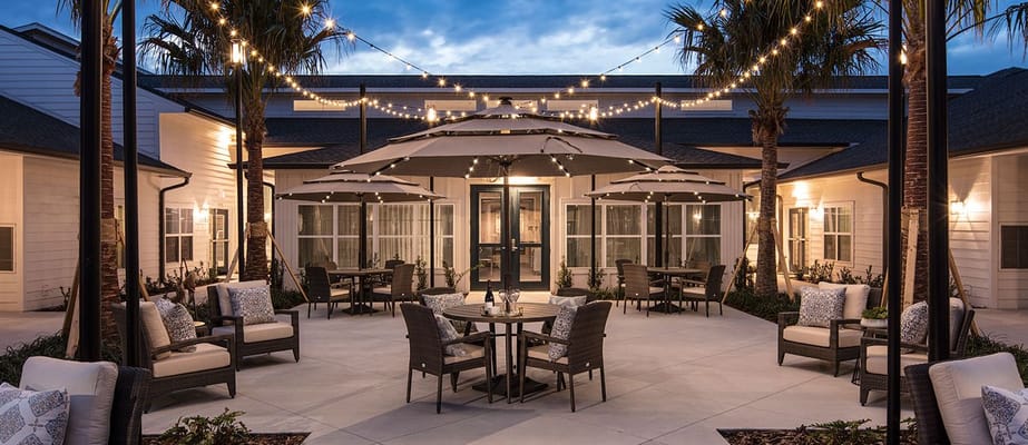 Outdoor patio with seating and string lights