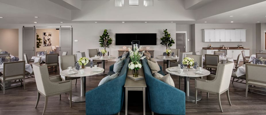 Elegant dining area with tables and chairs in a senior living facility