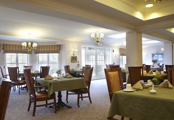 Dining room with tables set for residents