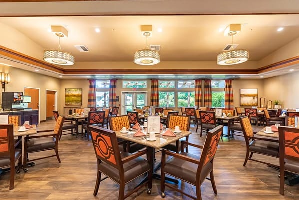 Bright dining room setup with neatly arranged tables