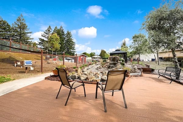 Outdoor seating area with a landscaped garden