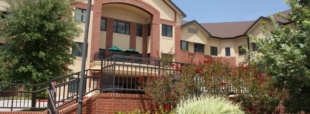 Exterior view of Vogel Center Assisted Living with landscaped gardens.