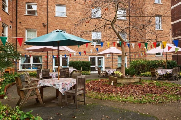Outdoor courtyard with tables and umbrellas