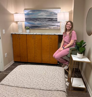 Staff member sitting in a bright treatment room
