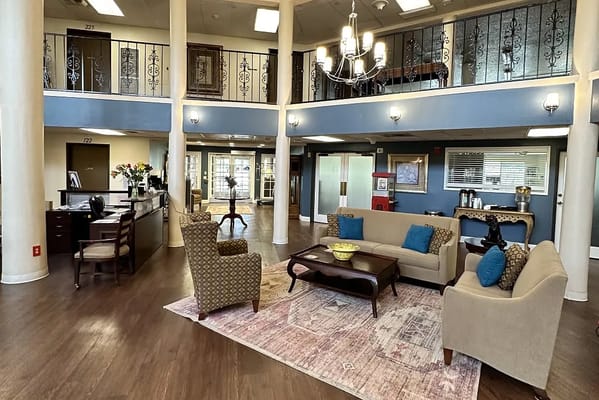 Spacious lobby with comfortable seating and reception desk