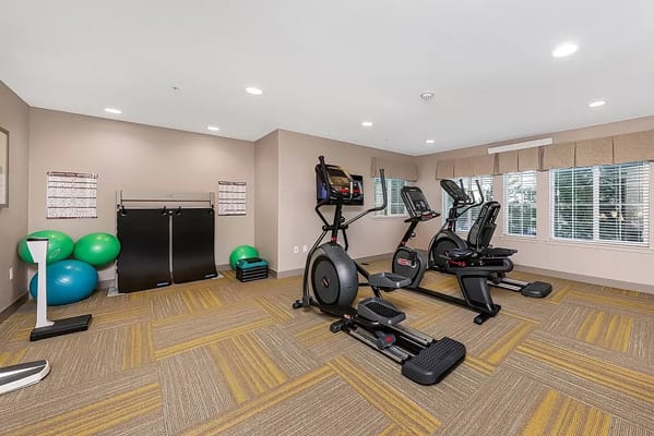 Exercise equipment in a bright fitness room