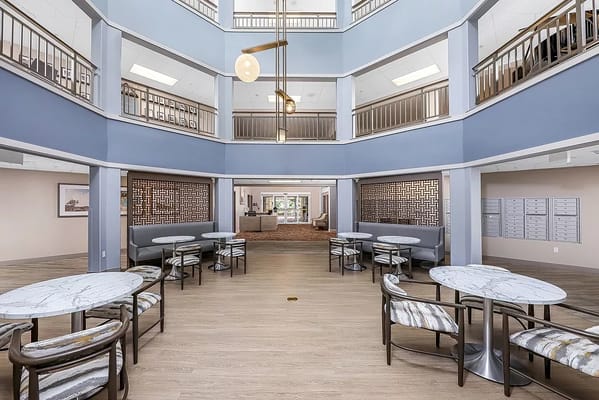 Interior view of a common area with tables and seating