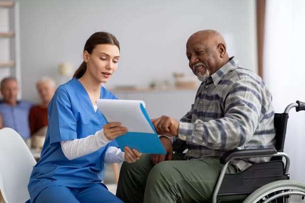 Caregiver assisting a resident with paperwork