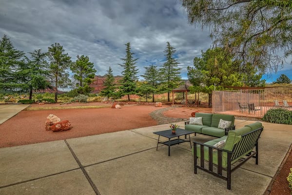 Well-maintained outdoor space with seating and landscaping