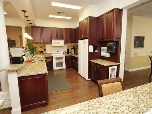 Modern kitchen interior with wooden cabinets and appliances