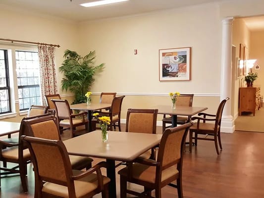 Bright dining room with flower centerpieces