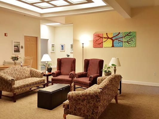 Cozy common area with seating and artwork