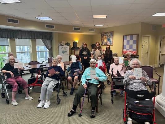 Residents engaging in an arts and crafts activity in a common area