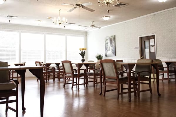 Interior view of a dining area with tables and chairs