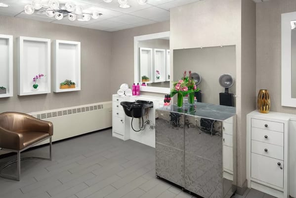 Interior hair salon area with styling stations