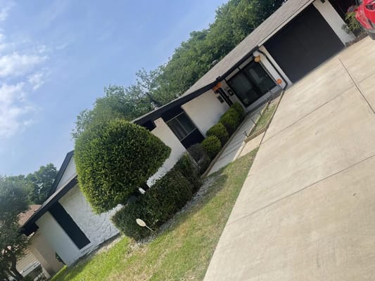 Front view of Kay's Komfort Homes with landscaped yard