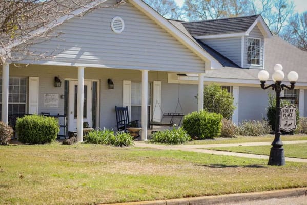 Exterior view of Kelley Place with porch and signage