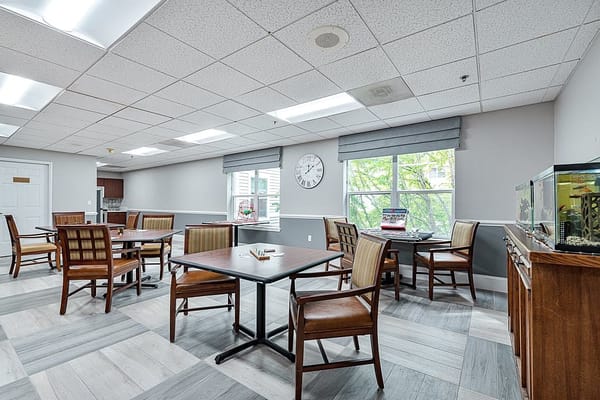 Dining area with tables and chairs in a well-lit room