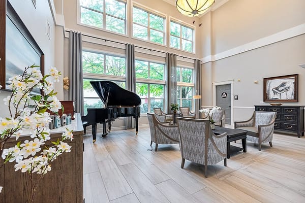 Bright and inviting lounge area with a grand piano