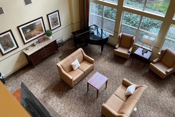 Common area with seating and a grand piano