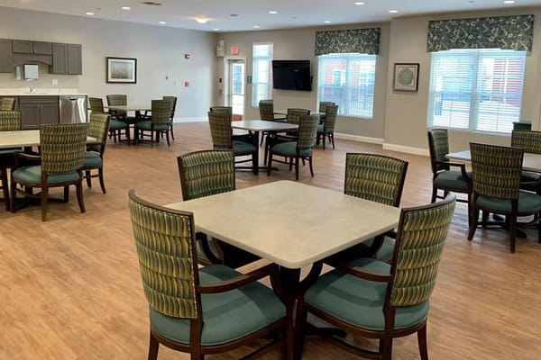 Bright dining area with tables and chairs