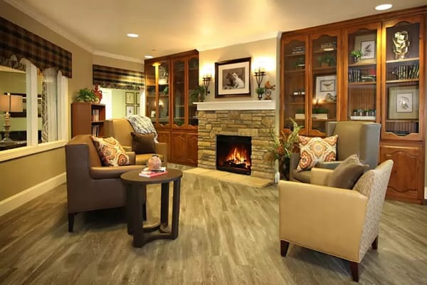 Cozy common area with seating and a fireplace at Legacy Ranch.