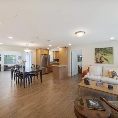 Spacious living room with dining area and kitchen at Home Suite Home