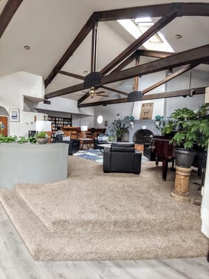Interior view of a common area with plants and seating