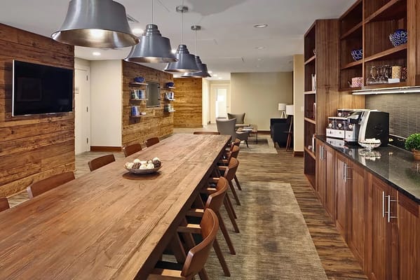 A modern dining area with wooden table and chairs