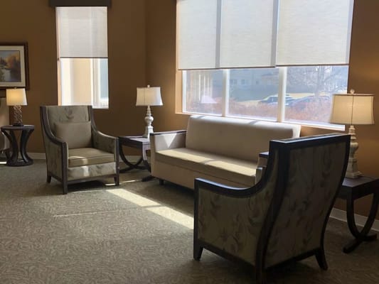 Comfortable common area with seating and natural light