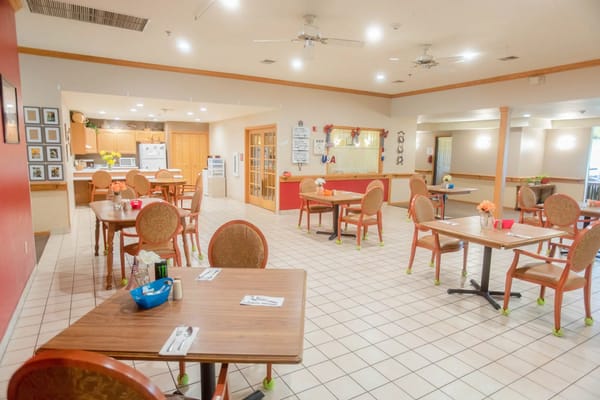 Bright dining area with tables and chairs