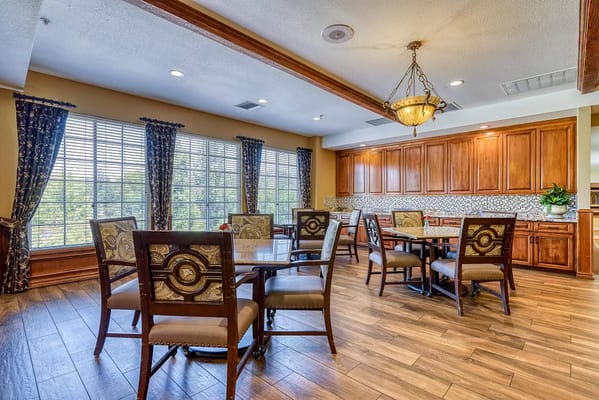 Bright dining area with wooden tables and chairs