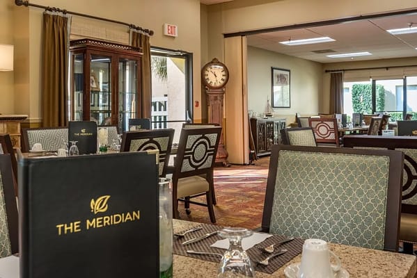 Dining area with elegant seating and decor