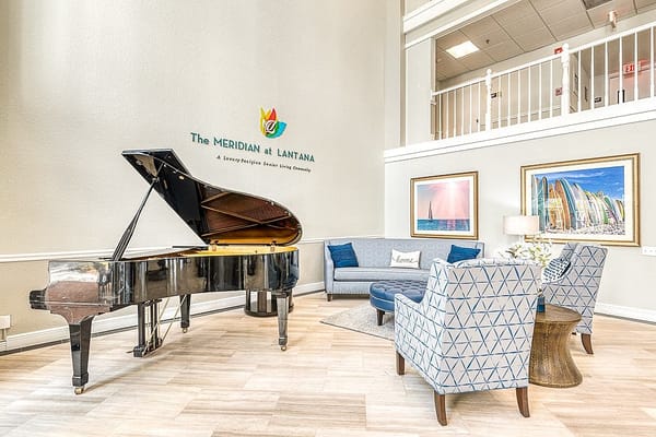 Interior view of a common area with piano and seating
