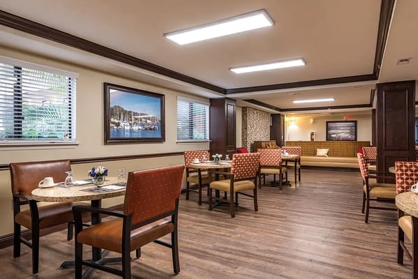Bright dining area with tables and chairs