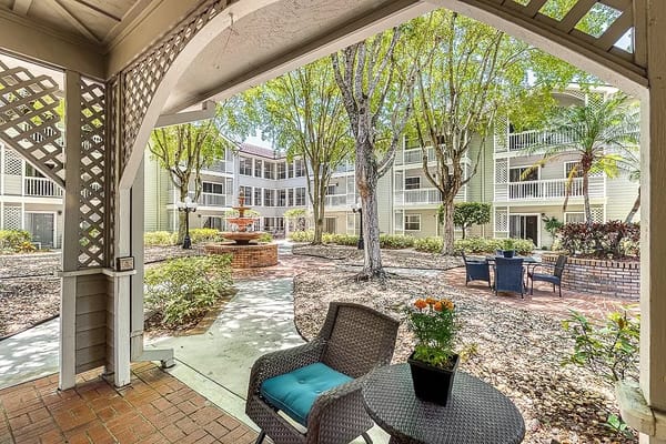 View of a serene outdoor space with seating and trees