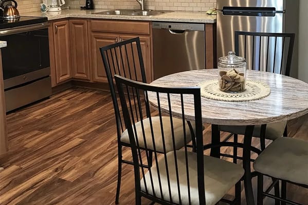 Modern kitchen interior with dining table and chairs