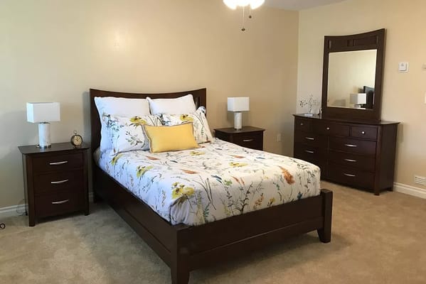 Cozy private bedroom with bed and nightstands
