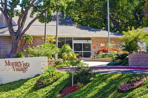 Exterior view of Monte Vista Village with landscaping