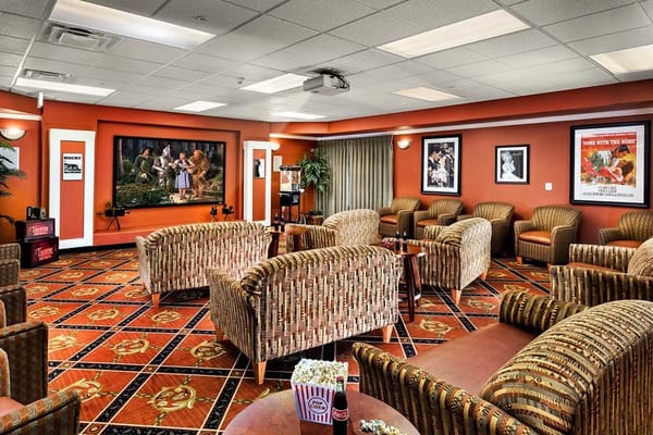 Bright common area with comfortable seating and entertainment